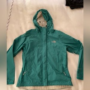 Green north face rain coat